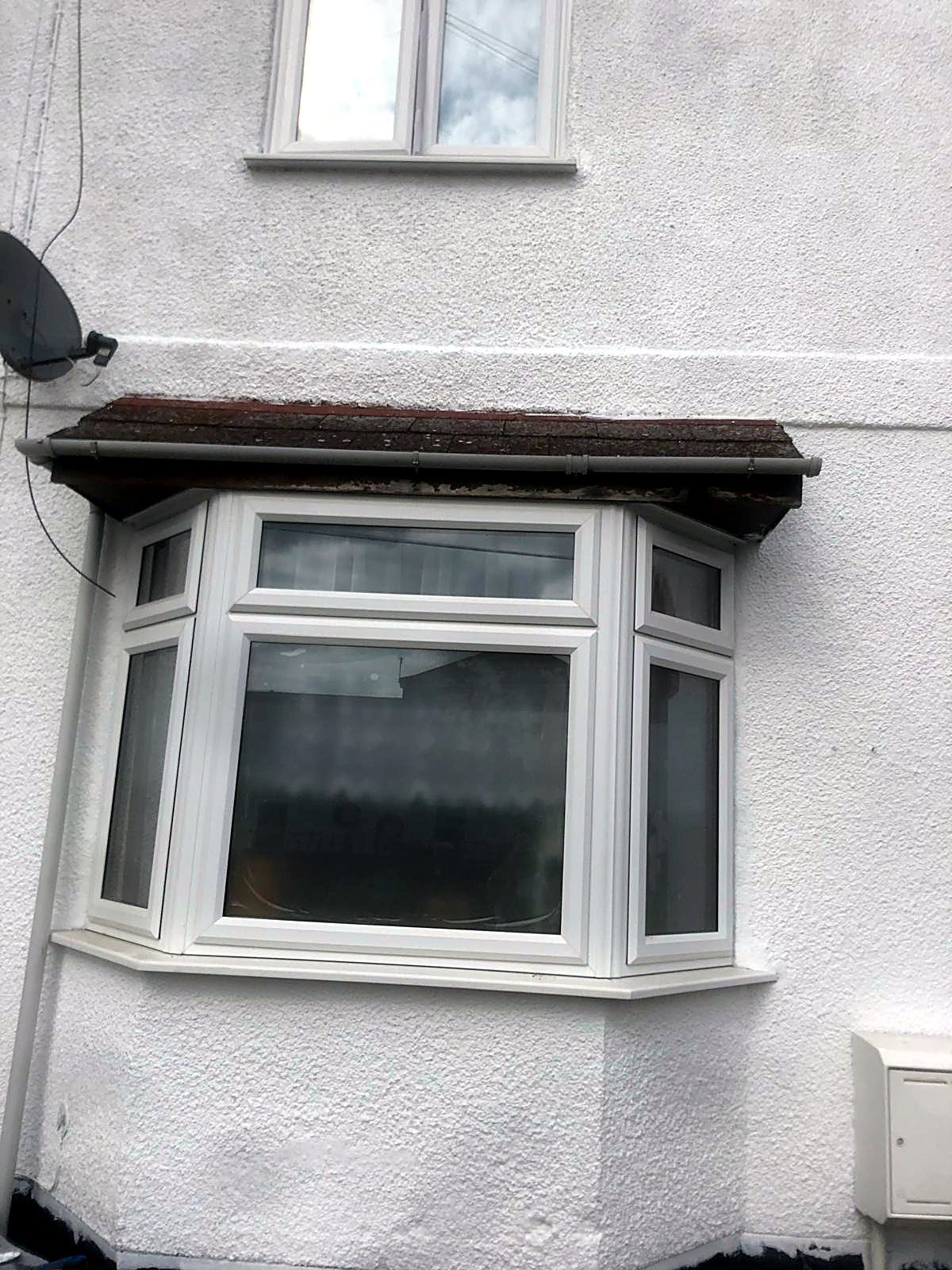 Exterior render repainted in fresh white