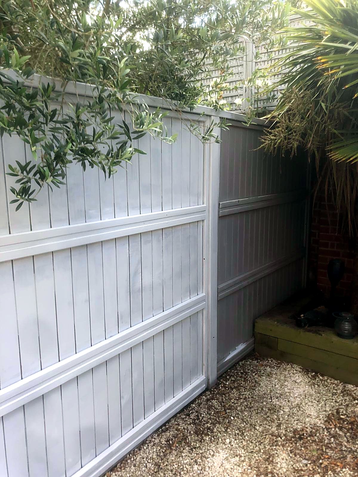 Garden fence painted light grey